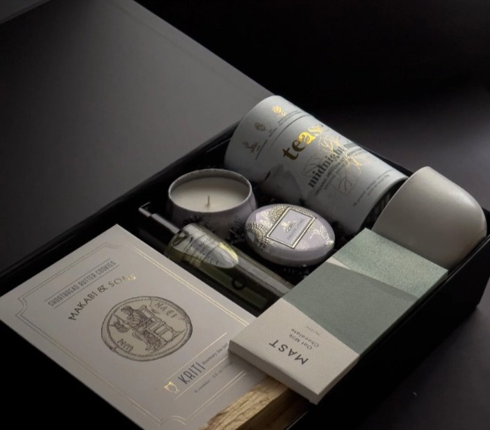 Tea gift box with scented candle, tea tin, and a ceramic cup